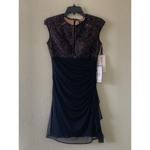Women’s black dress size 8P, but fits small.
